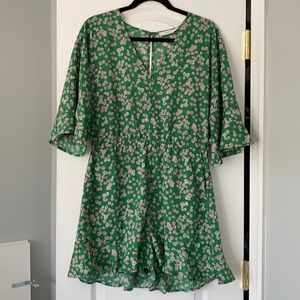 Green romper with pink floral details